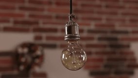 Filament Lamp, turned on, Edison bulb. Incandescent light suspended in room has been turned on. - Powered by Shutterstock - Get 15% off with code: PIKWIZARD15