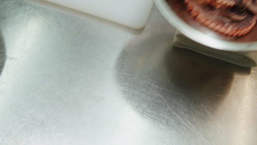 Chef cooking octopus, japanese cuisine, man cook seafood with boiling water, raw fresh fish for sushi sashimi, boiled steamed octopus, mediterranean restaurant, spanish kitchen.  | Shutterstock HD Video #1108858309