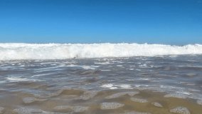 Beautiful View on high waves on the empty coast of the Atlantic Ocean. Deserted beautiful ocean beach. 4K resolution sea video banner. Waves crash into the camera