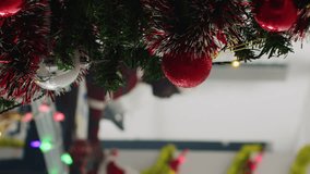 Vertical video Revealing shot of manager dressed as Santa Claus spreading holiday joy in festive ornate office, offering presents to employees. Team leader surprising overjoyed company workers with