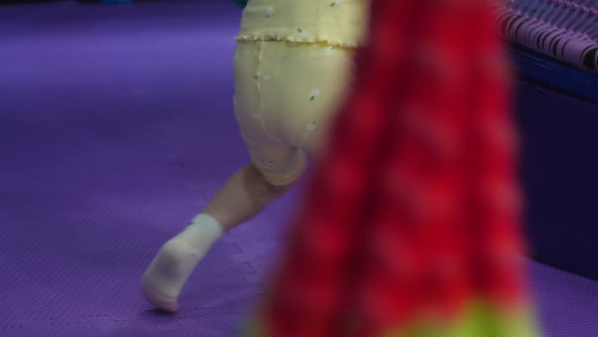 a preschool girl swings on a swing in an amusement park, children