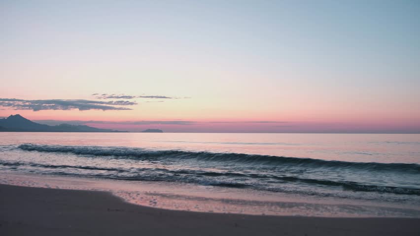 Sunrise over the beaches and mountains in Alicante Spain. Seascape with mountains