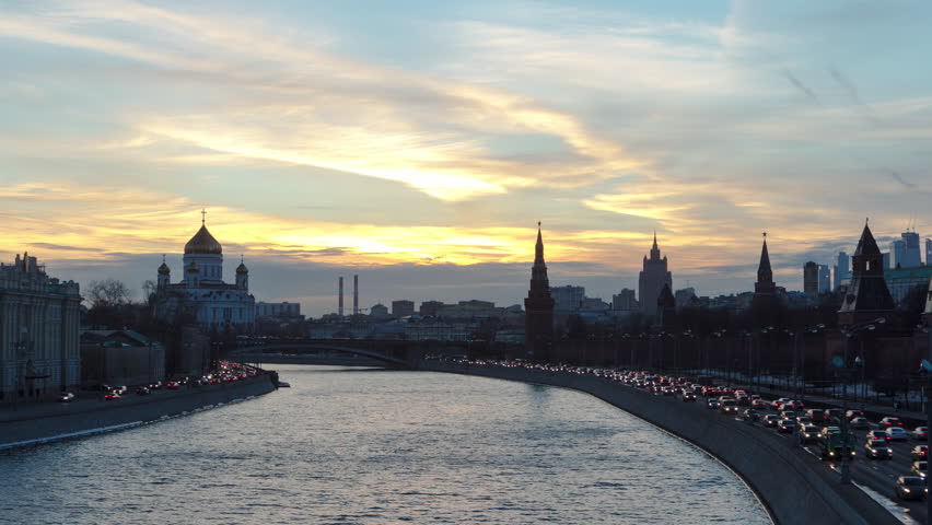 Winter Day to Night Transition Hyperlapse: Captivating Ensemble of Moscow Kremlin and Moskva-City Business Center View across Moskva River. Witness the Transforming Beauty as Daylight Turns into Night