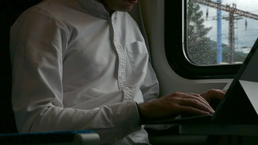 Young Business Traveler - Laptop Computer Work - Train Coupe Window - Rainy Summer Day