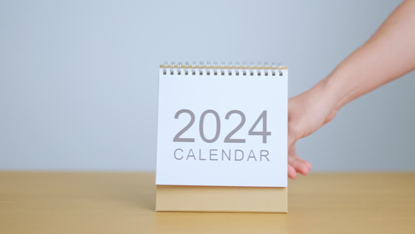 2024 Year Calendar on table background. Happy New Year, Resolution, Goals, Plan,  Action, Mission and financial Concept