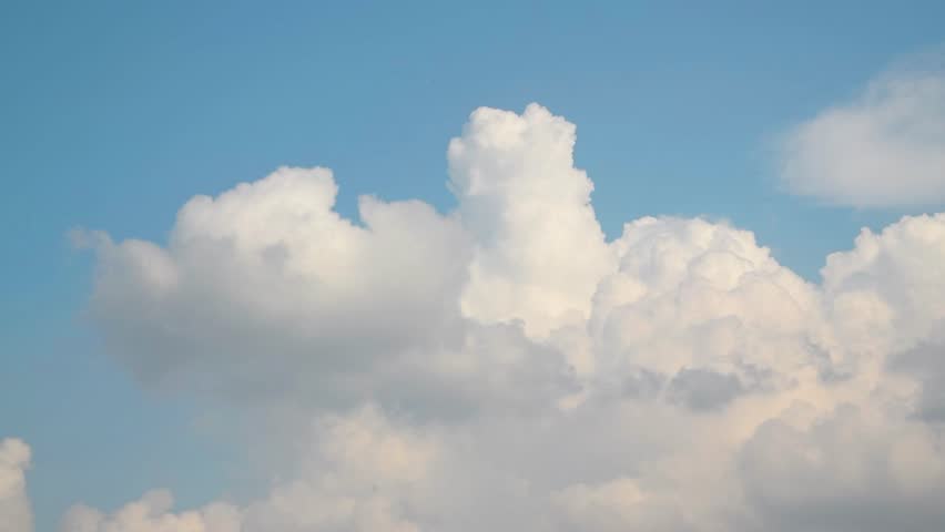 Blue sky white clouds. Puffy fluffy white clouds. Cumulus cloud cloudscape timelapse. Summer blue sky time lapse. Nature weather blue sky. White clouds background. Cloud time lapse , video loop Royalty-Free Stock Footage #1108897951