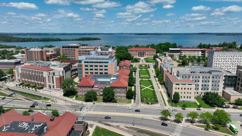 Henry Mall on University of Wisconsin campus in Madison, WI. Aerial truck shot of academic buildings with Lake Mendota in the background.