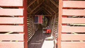 Push in wide shot of an outdoor kids playroom with a table and chairs and an American flag hanging - Powered by Shutterstock - Get 15% off with code: PIKWIZARD15