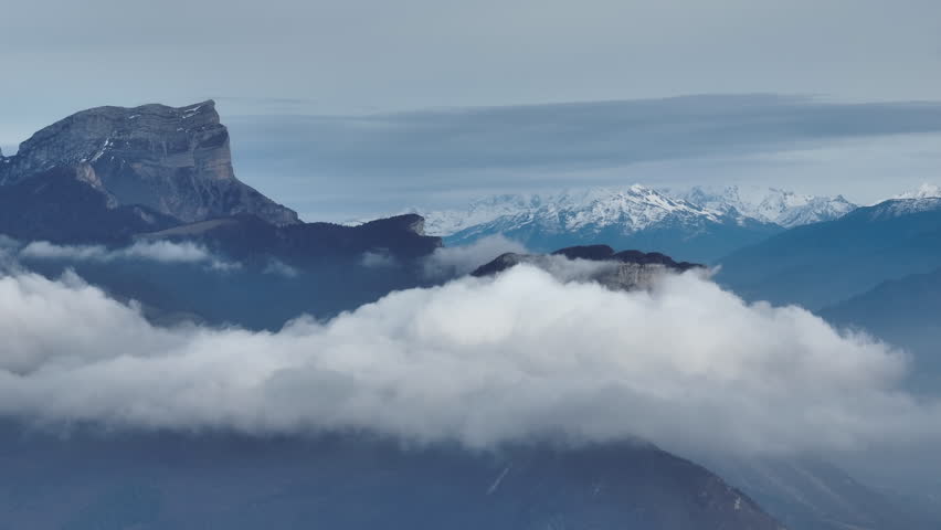 Mysterious atmosphere clouds over mountains Grenoble 