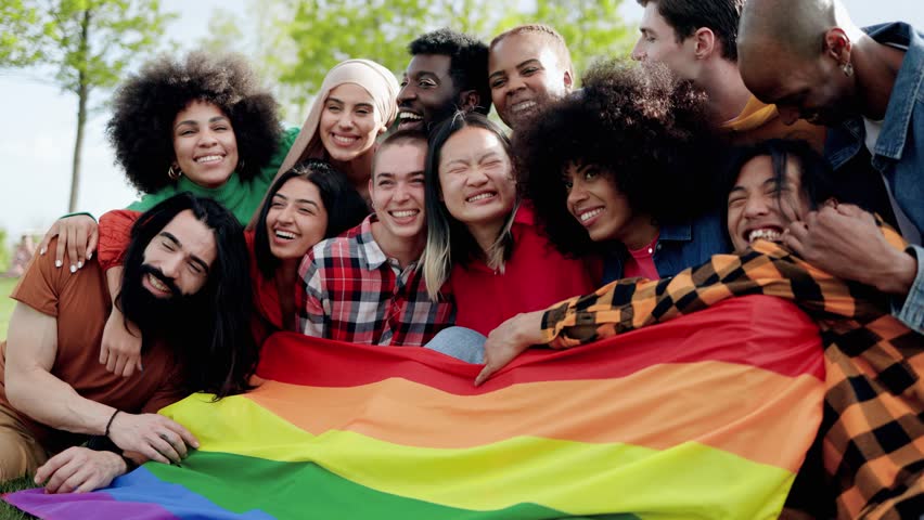 Happy multiracial people holding LGBT pride rainbow flag outdoors - Diversity concept Royalty-Free Stock Footage #1108903691