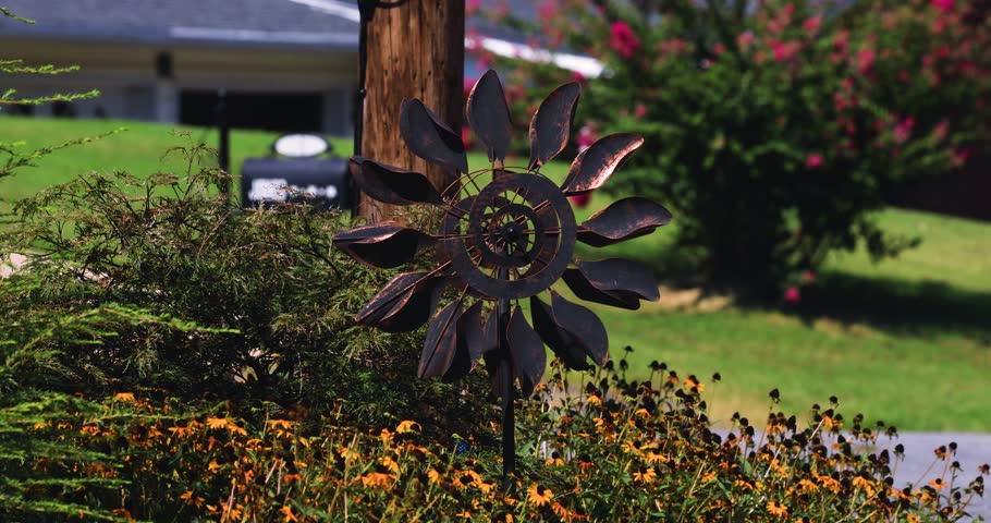 Copper Wind Spinner in the flower garden.