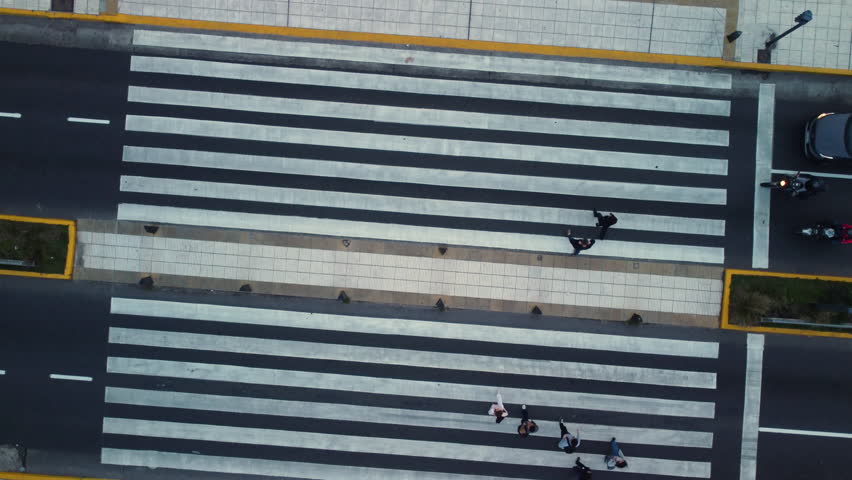 People cross a zebra crossing, pedestrian crossing, top view, drone rotates, bright road markings Royalty-Free Stock Footage #1108908281