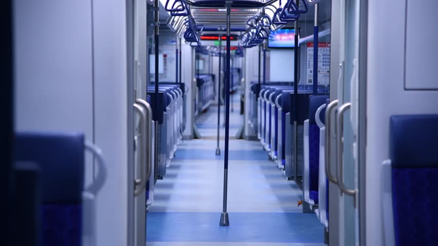 Empty wagon of modern passenger train with blue sits. Soft focus. Real time handheld video. Public transportation theme. | Shutterstock HD Video #1108908491