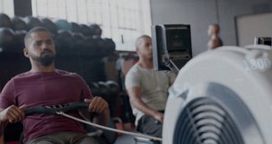 Animation of data processing on graph over diverse men training on rowing machines at gym. Fitness, exercise, strength, data, digital interface and technology digitally generated video.