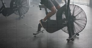 Animation of graph processing data over caucasian man cross training on elliptical at gym. Fitness, exercise, strength, data, digital interface and technology digitally generated video.
