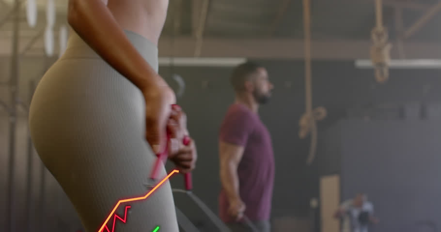 Animation of graph processing data over diverse woman and man jumping rope cross training at gym. Fitness, exercise, strength, data, digital interface and technology digitally generated video. | Shutterstock HD Video #1108916505
