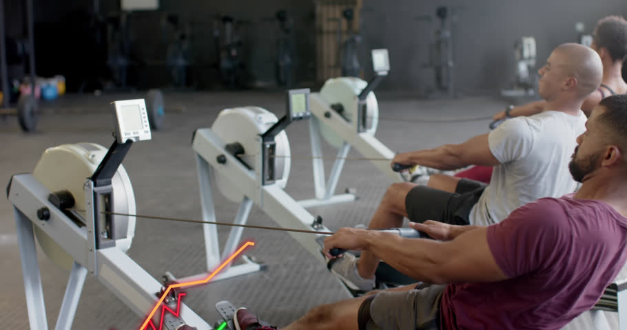 Animation of graph processing data over diverse group training on rowing machines at gym. Fitness, exercise, strength, data, digital interface and technology digitally generated video. | Shutterstock HD Video #1108916905