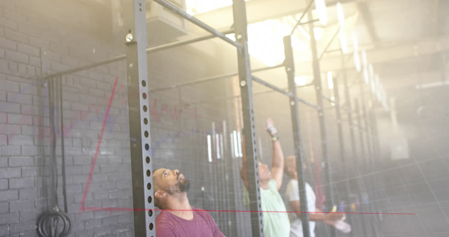 Animation of graph processing data over diverse male group training on pull up bars at gym. Fitness, exercise, strength, data, digital interface and technology digitally generated video. | Shutterstock HD Video #1108916925
