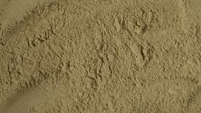 Pile of Maca powder, close-up. 4K video, Rotating. Maca gelatinized flour. Texture. Peruvian superfood, natural food supplement.