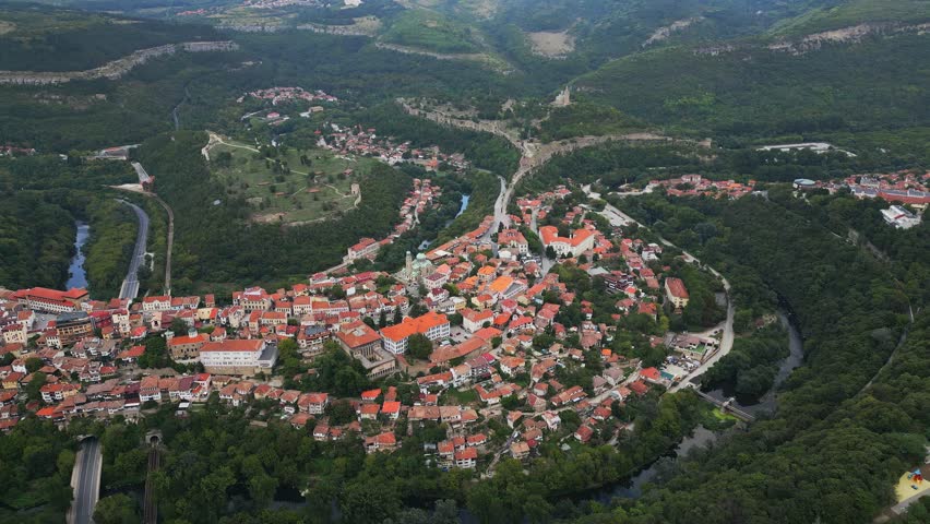 An aerial view of Veliko Tarnovo reveals a Bulgarian city rich in history and culture, with its beautiful buildings, streets, and picturesque hills.