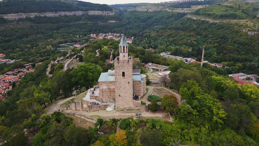 An aerial view of Veliko Tarnovo reveals a Bulgarian city rich in history and culture, with its beautiful buildings, streets, and picturesque hills. Royalty-Free Stock Footage #1108930995