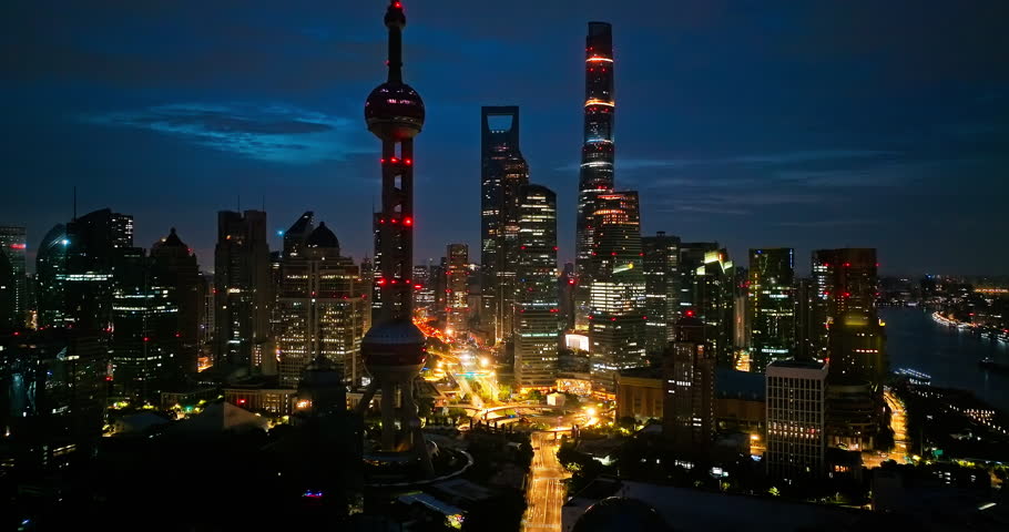 Aerial photography of Shanghai city skyline and at dawn. Advertising and trademark removed creative video
