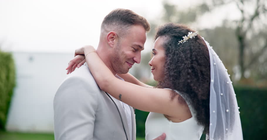 Wedding, couple and love dancing outdoor together, happy and celebration for care and commitment. Marriage, man and woman moving with eyes closed, bride and groom embrace for first dance in nature Royalty-Free Stock Footage #1108934785