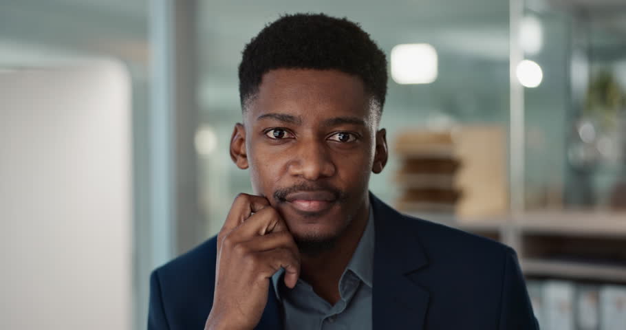 Face, smile and young businessman in office with confidence and positive attitude for startup at work. Employee, professional and portrait of black man and happy or ready for career in accounting