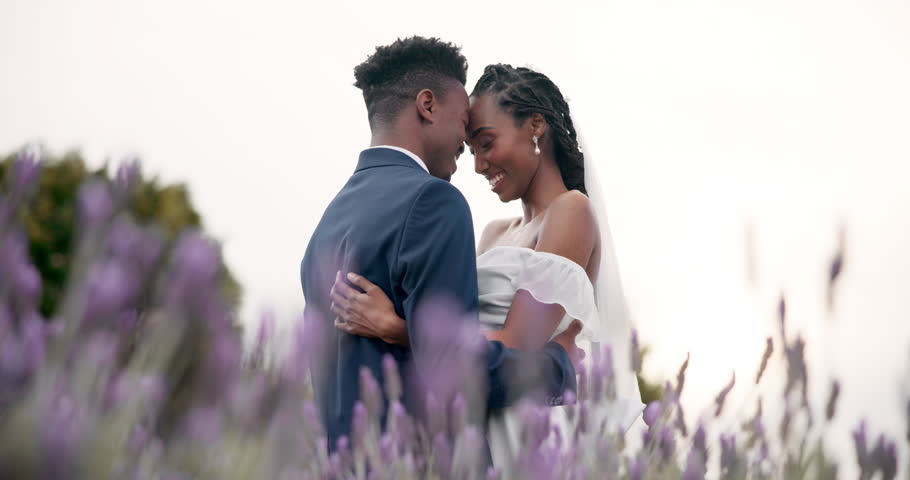 Wedding, bride and groom hug in a field, dancing and celebration of love with happiness and commitment. Marriage, trust and black people in relationship, event and nature with love and care outdoor Royalty-Free Stock Footage #1108934999