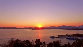 aerial panorama view beautiful yellow sunset above the sea.
Looping video features a beautiful scene with the setting sun painting the sky above mountain range.
stunning red sky background.
