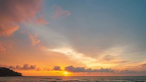 colorful light through to the cloud above the ocean.
Clouds are moving slowly in stunning sunset video 4K. Nature video High quality footage 
Scene of Colorful romantic sky sunset background.
