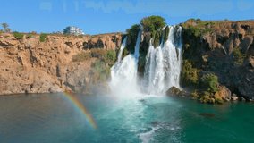 Slowmotion aerial video of the Lower Duden Waterfall in the city of Antalya. The drone slowly rotates around the waterfall right to left. It is close to the sea level. - Powered by Shutterstock - Get 15% off with code: PIKWIZARD15