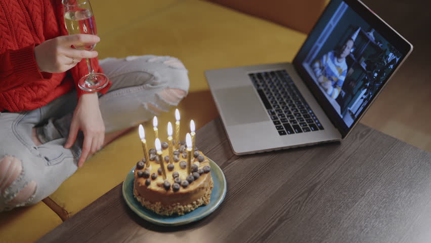 Happy Asian woman and her male man friend celebrating Happy Birthday Using Laptop Video Call. Social distancing. Girl cheers champagne glass with boyfriend online and drink. candles burning on cake Royalty-Free Stock Footage #1108940017