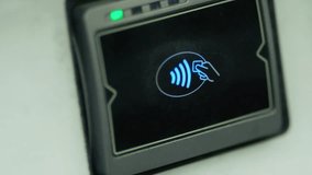 Contactless payment device featuring a logo - Powered by Shutterstock - Get 15% off with code: PIKWIZARD15