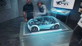 Two male automotive engineers develop new eco-friendly electric car using futuristic augmented reality holographic automobile prototype. 3D graphics of vehicle high-tech developing. VFX animation. - Powered by Shutterstock - Get 15% off with code: PIKWIZARD15