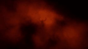 Horned evil demon stands inside gloom. Spooky angel 2D animation. Horror fantasy genre. Mysterious light inside murk. Animated nightmares video clip. Creepy dark character. Orange and black background