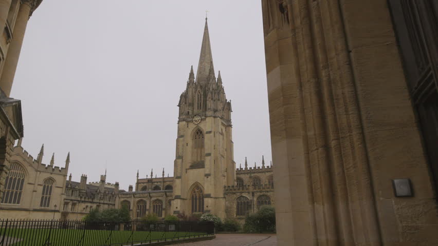 Oxford University Church of St Mary the Virgin. The oldest part of XIII century church tower building with clock. Architecture Oxford university buildings 