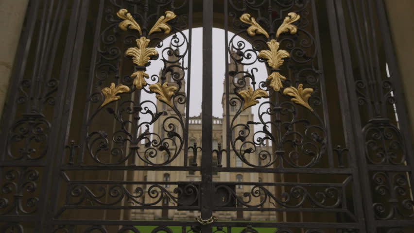 Beautiful exterior gates closed with lock to Oxford university behind. Architecture british schools education in UK concept