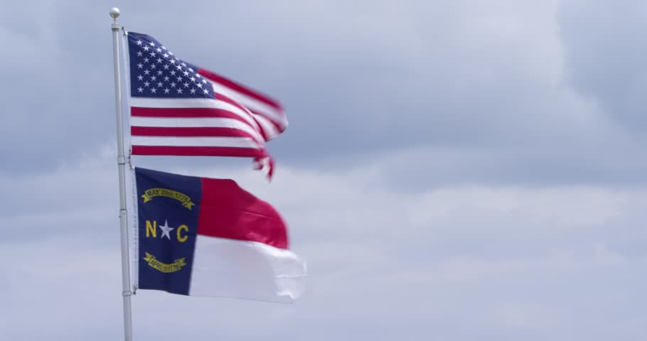 The North Carolina state flag flies alongside the stars and stripes.