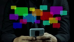 Businessman hand using smartphone typing Live chat chatting and social network concepts, chatting conversation working in bubble chat box icons pop up. Social media marketing technology concept. - Powered by Shutterstock - Get 15% off with code: PIKWIZARD15