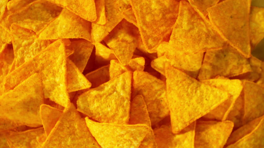 Super slow motion of flying tortilla chips on color gradient background. Filmed on high speed cinema camera, 1000 fps. Camera placed on high speed cine bot, tracking the target. Royalty-Free Stock Footage #1108962199