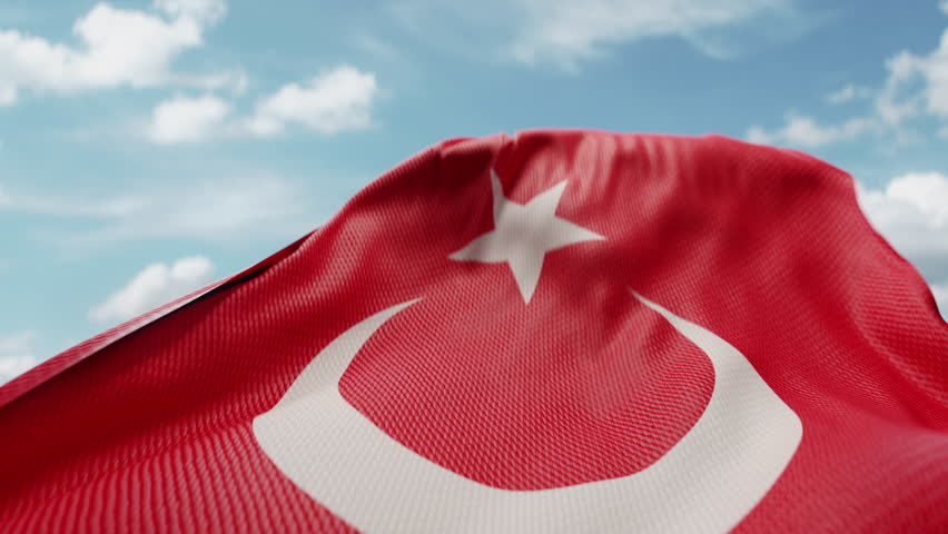 Wavy flag of Turkey blowing in the wind in slow motion. Waving official Turkish flag team symbol abstract vertical background. Blue sky with clouds. World countries flying flags concept Royalty-Free Stock Footage #1108964507