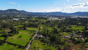 Spectacular aerial video over the municipality of La Ceja, located in the east of Antioquia, where housing units, agricultural farms and commercial activities converge on both sides of the road.