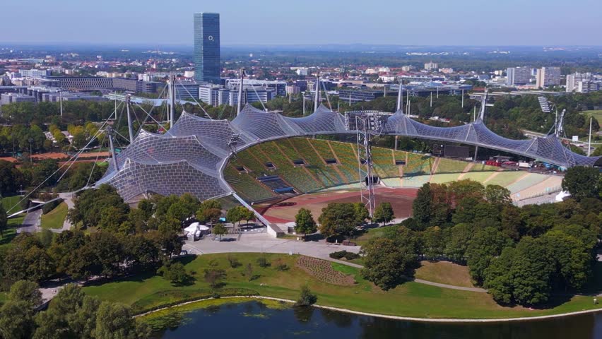 Gorgeous aerial top view flight Olympiastadion Munich Park Germany arena. drone