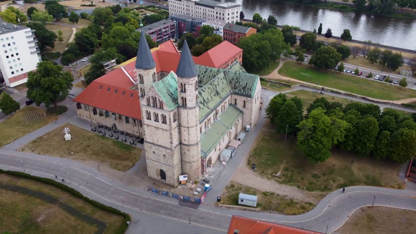 Aerial view of Magdeburg with the monastery, drone shot flying around the monastery of Magdeburg | Shutterstock HD Video #1108974403