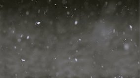 Natural phenomenon in winter, snow and wind blowing, view from the window in the house in the village, slow motion of snowflakes, slow motion video.