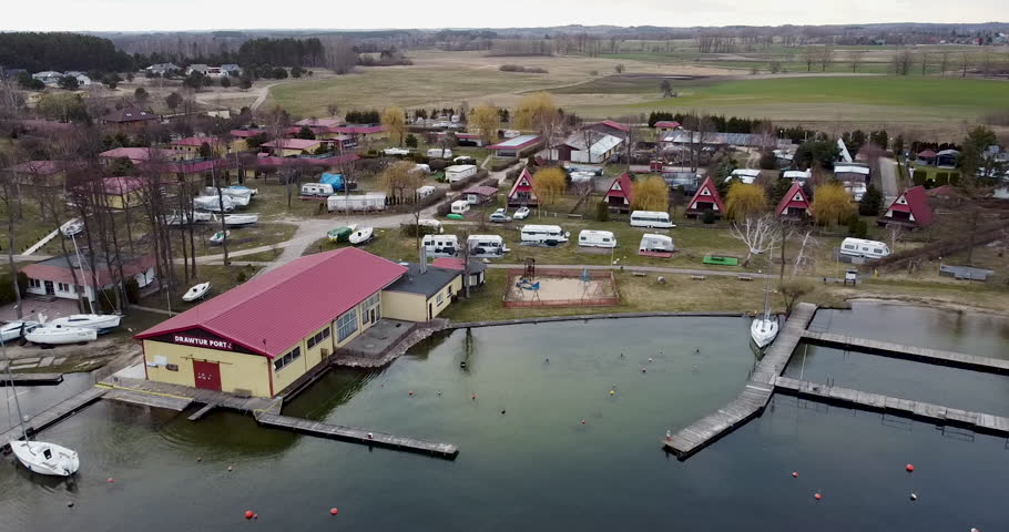 Drone aerial view of Village on Czaplinek city in Poland near a lake where is also a camping spot