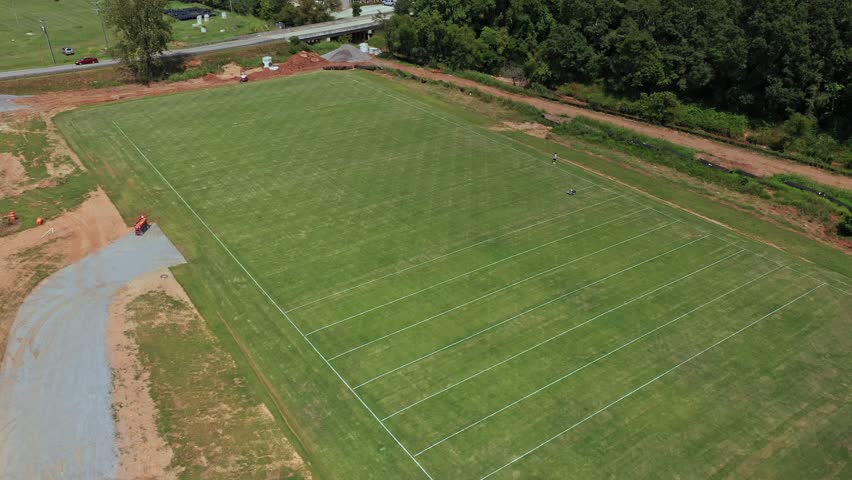 Aerial shot of Anderson University Athletic Field, Anderson, South Carolina. Robot painting lines in the field.