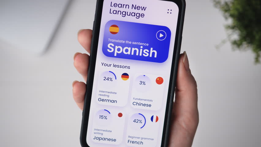 Learning a foreign language online using an educational app. Studying online using e-learning application on a smartphone. Royalty-Free Stock Footage #1108982059