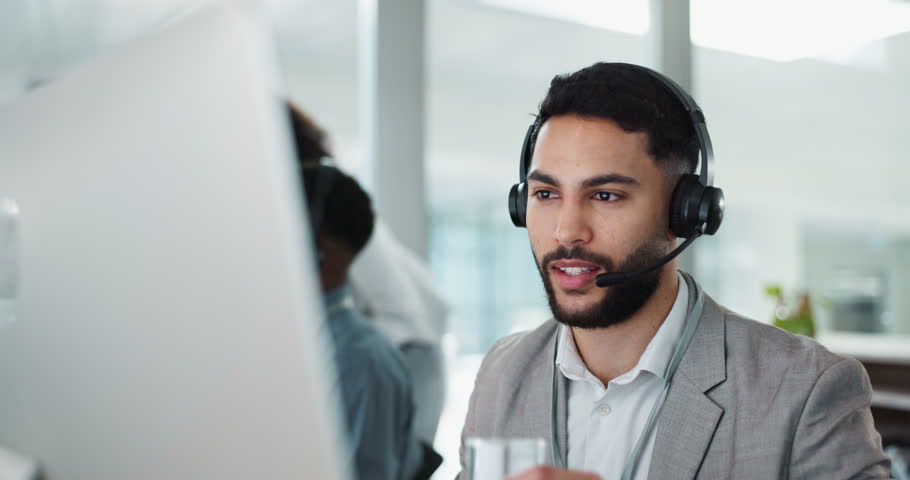 Happy businessman, call center and talking in customer service or telemarketing at office. Man, consultant or agent drinking water with headphones and consulting for online advice, support or help